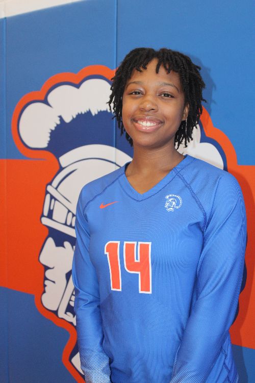 Athlete posing for photo in blue jersey